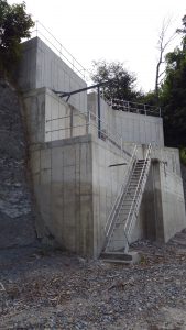 Masonry -- Large concrete retaining wall / butress