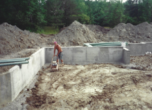 Foundations -- Tamping the dirt of a basement foundation floor