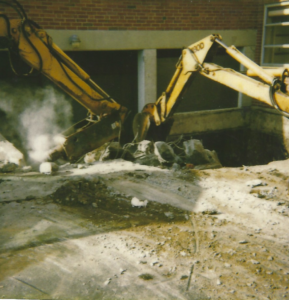 Basement Wall Replacement -- Excavators removing old wall
