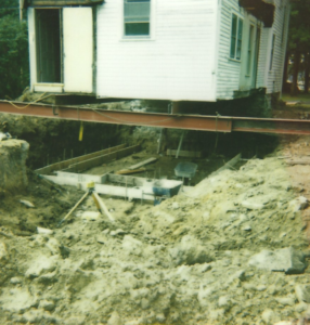 Excavating -- Excavation beneath a house